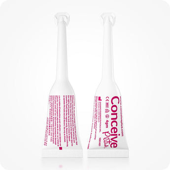 Conceive Plus Fertility Lubricant (3x4g Pre-filled Applicators) showing front and back views of two single-use pre-filled fertility lubricant applicators with pink printed instructions and branding, photographed on a clean white background for detailed product display.
